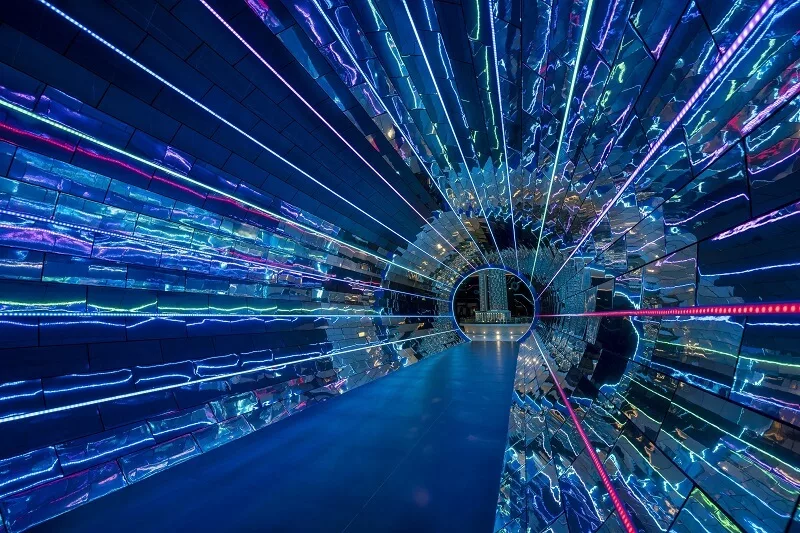 Walking through the futuristic tunnel in the Futuristic Galaxy Walk, showcasing innovative design elements.