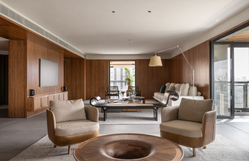 Spacious living room featuring neutral palettes and wooden panels