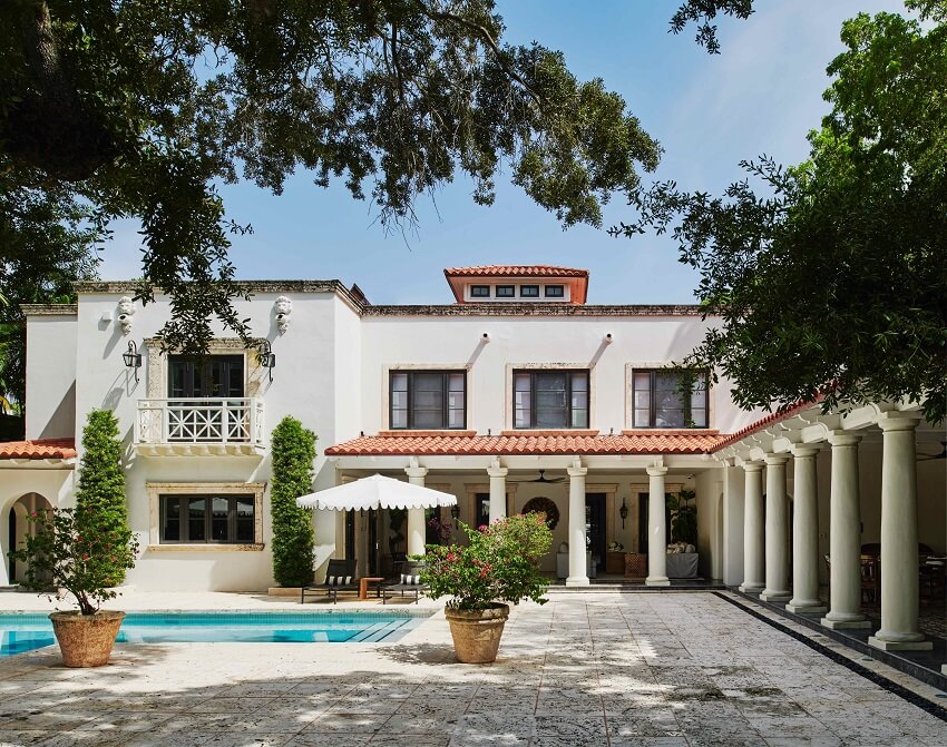 Front exterior of Coconut Grove Villa, surrounded by lush greenery