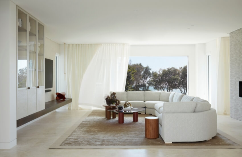 Comfortable living area with large windows overlooking the South Coast scenery