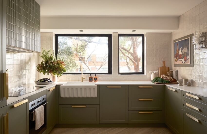 A modern kitchen with simple shaker-style cabinets and locally sourced hardware