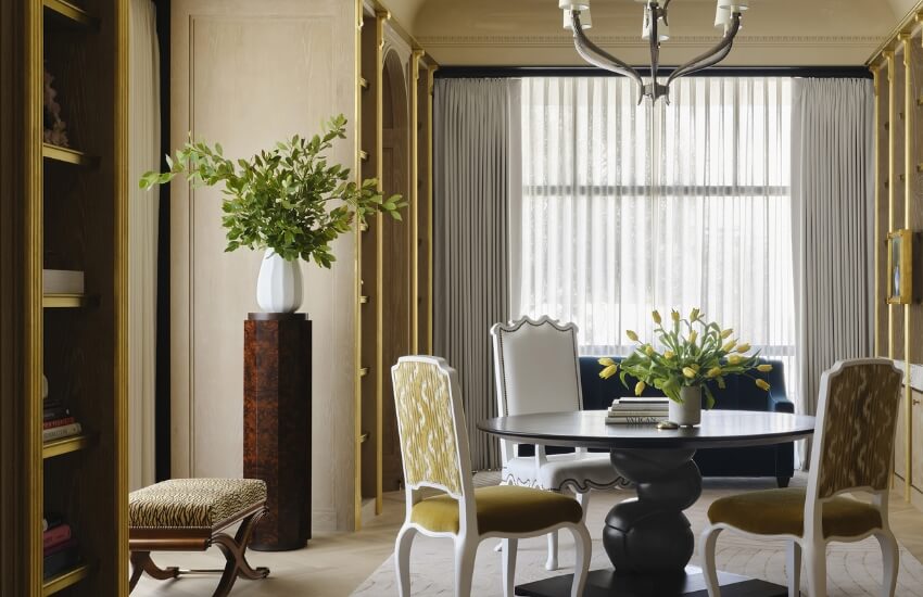 Relaxed interior lounge with circular table and minimalist desert-inspired palette