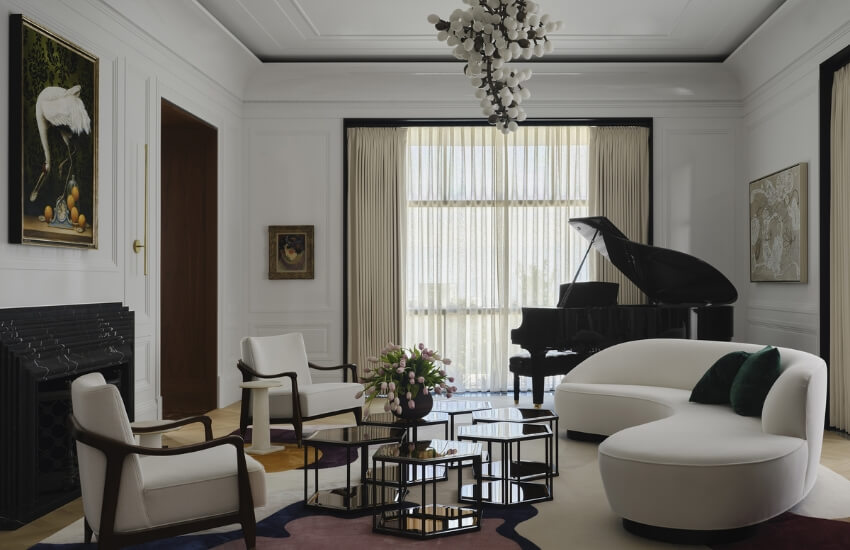 Elegant desert residence living room with piano beside large window and natural light