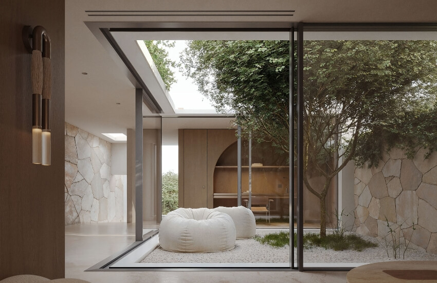 View from inside the villa toward an inner courtyard with open roof