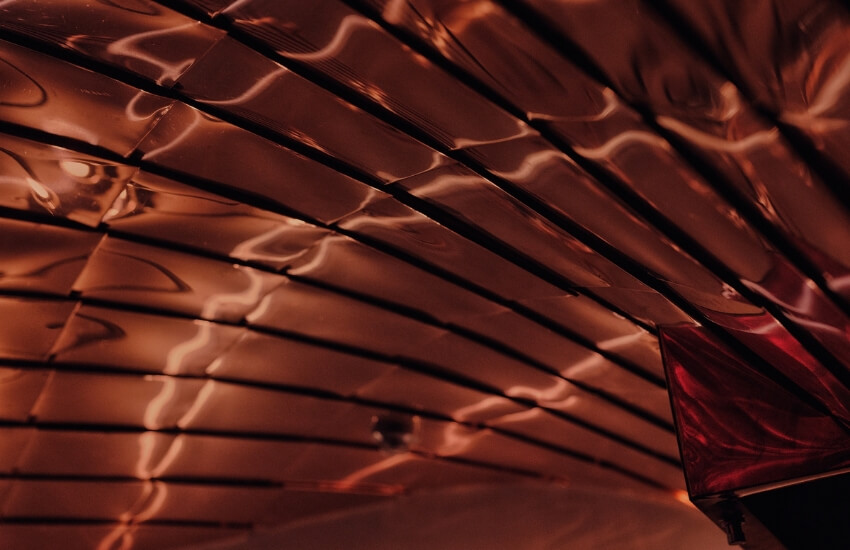 Close-up of copper ceiling tiles in Poppy Lounge, handcrafted using traditional Japanese technique