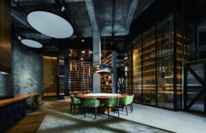 Exhibition space with round table and warm lighting inside MWH Life style Center