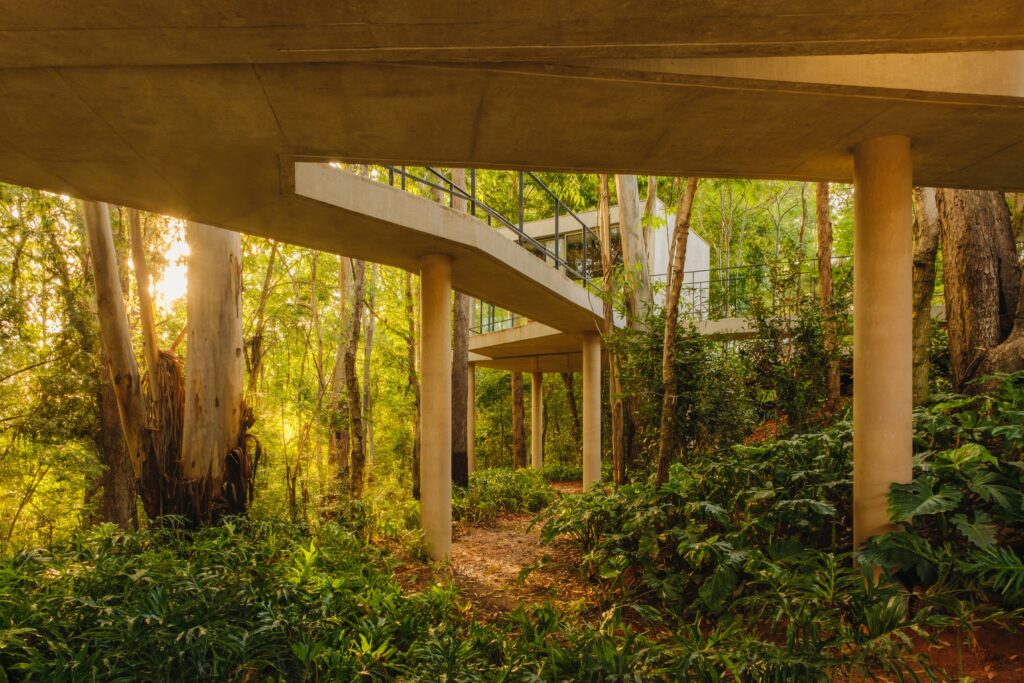 14.5-meter walkway bridge connecting courtyard to forest area