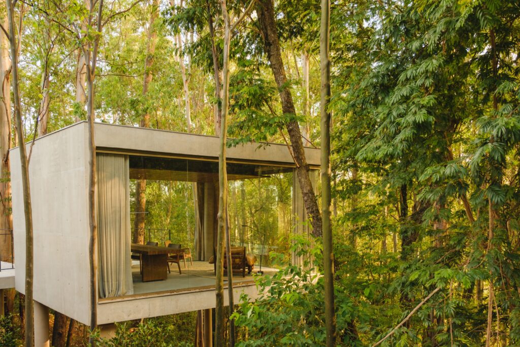 Elevated private volume with brise-soleils above the main house